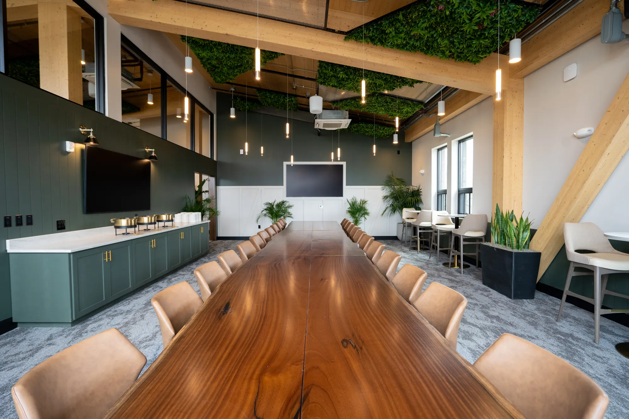 Long wood table in the Sky Room at Lani Rooftop