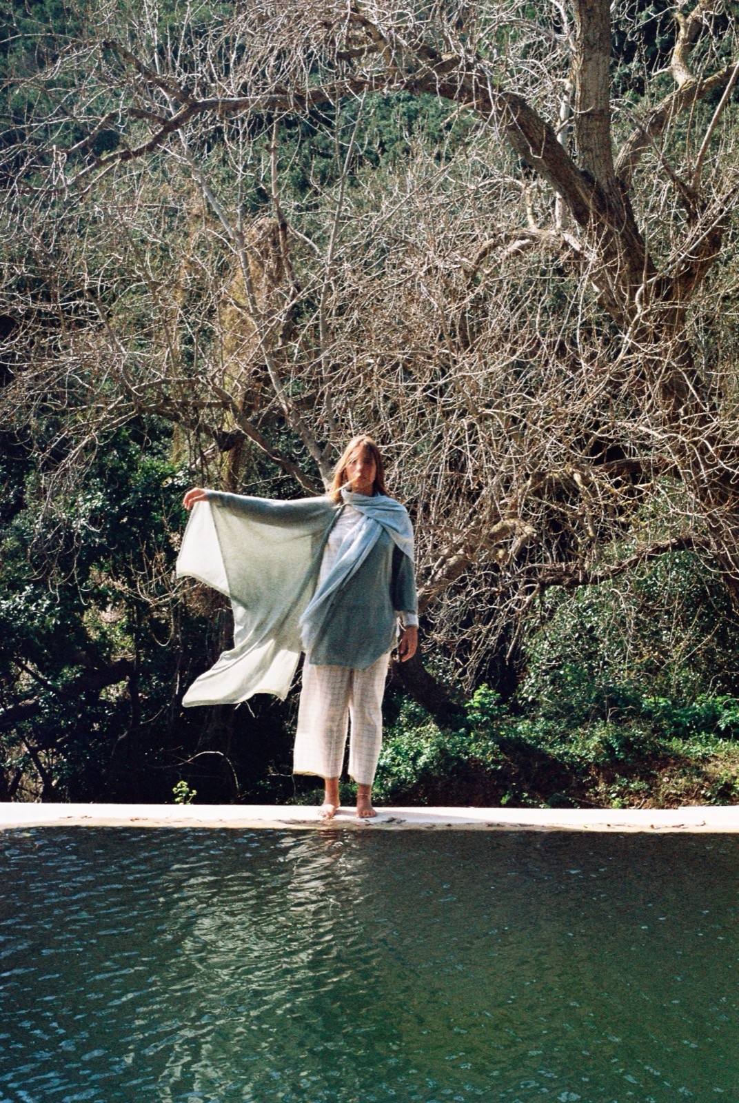 Streetside billboard with flyposters of the Batch.Works brand and illustrations