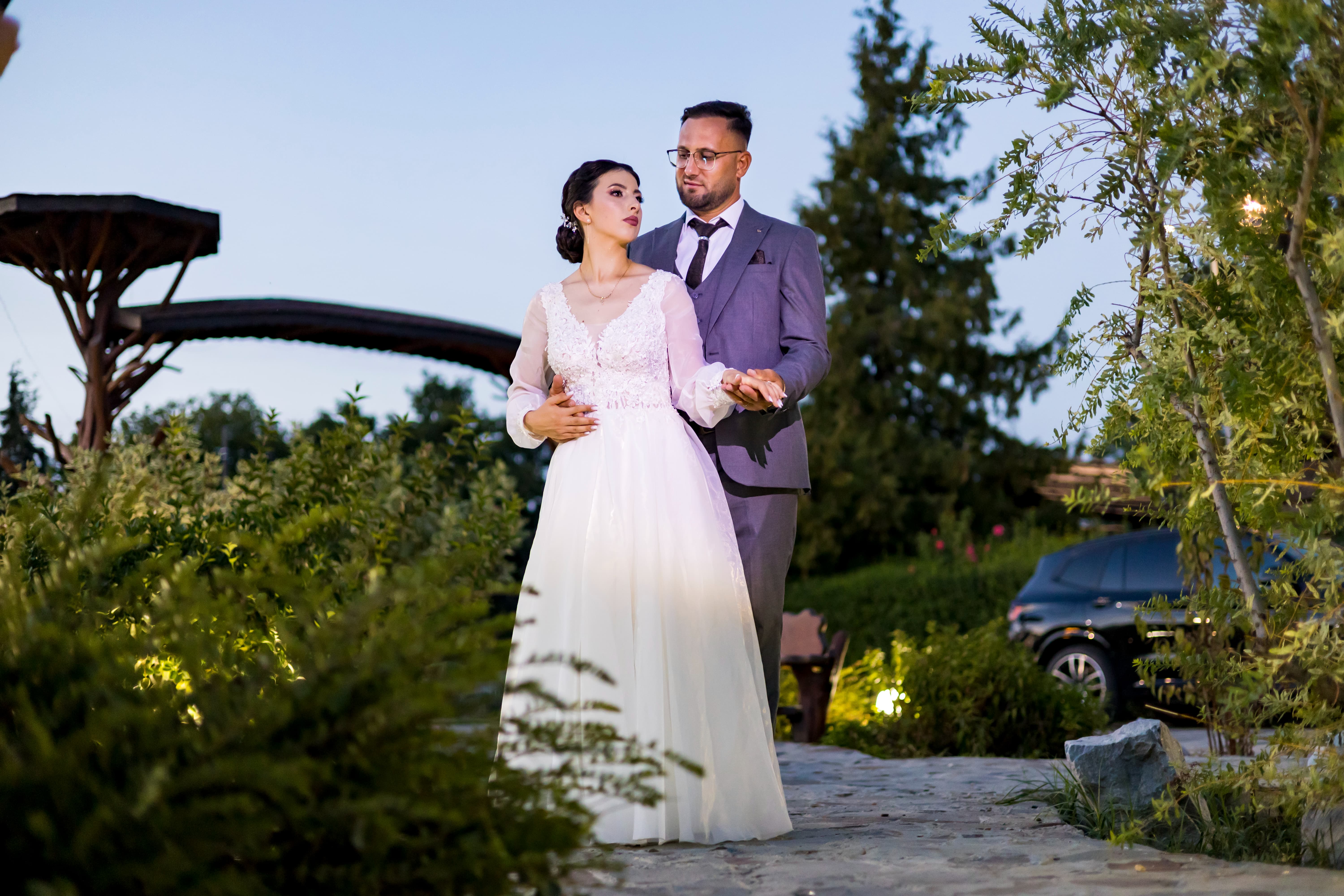 A bride in an elegant white gown.