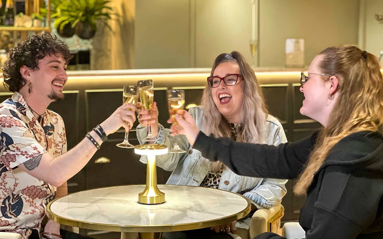 Guests enjoying champagne at Madame Tussauds London Champagne Bar.