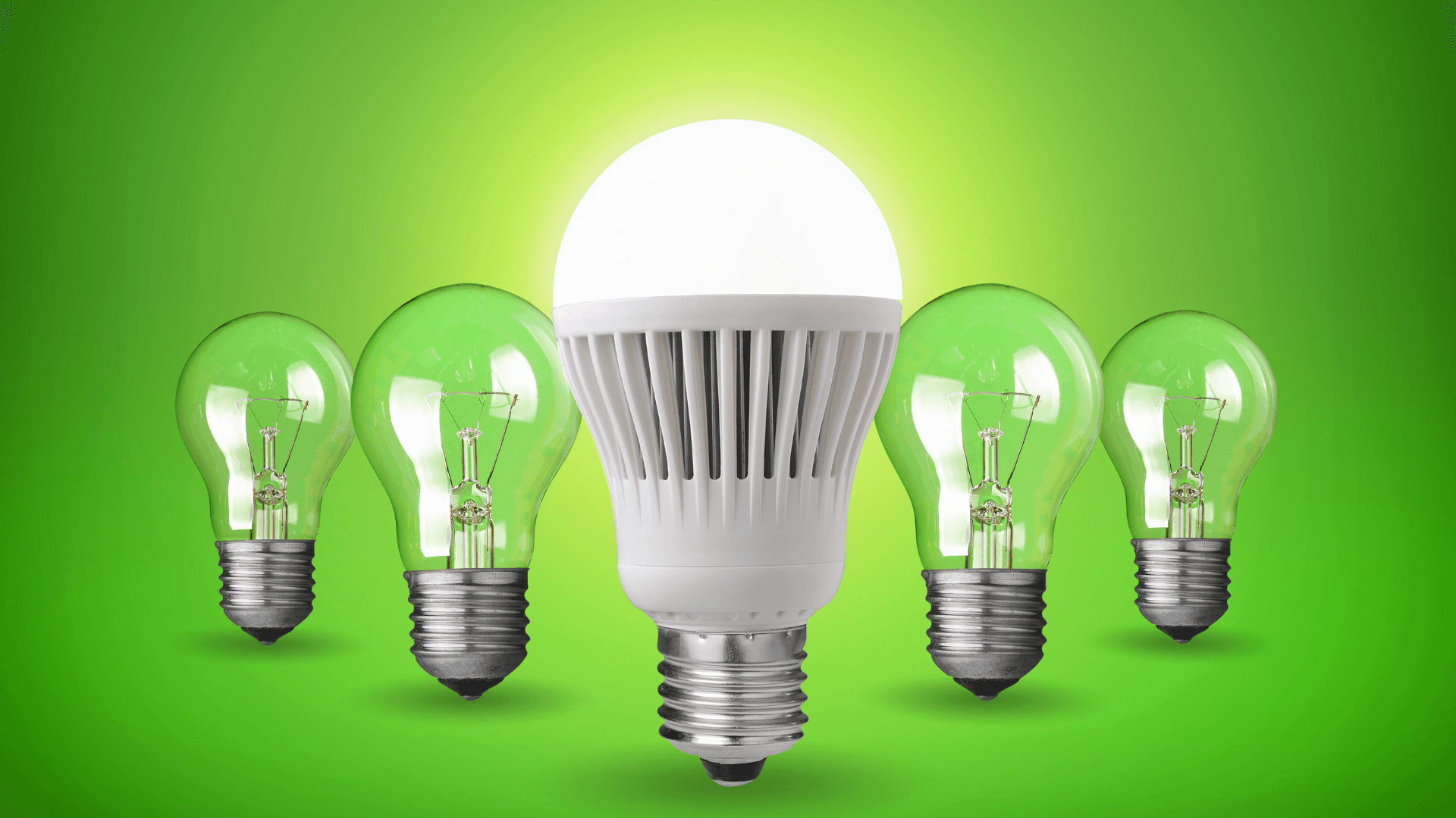 An assortment of modern LED and energy-efficient light bulbs glowing brightly in a living room, showing cost-effective lighting solutions.