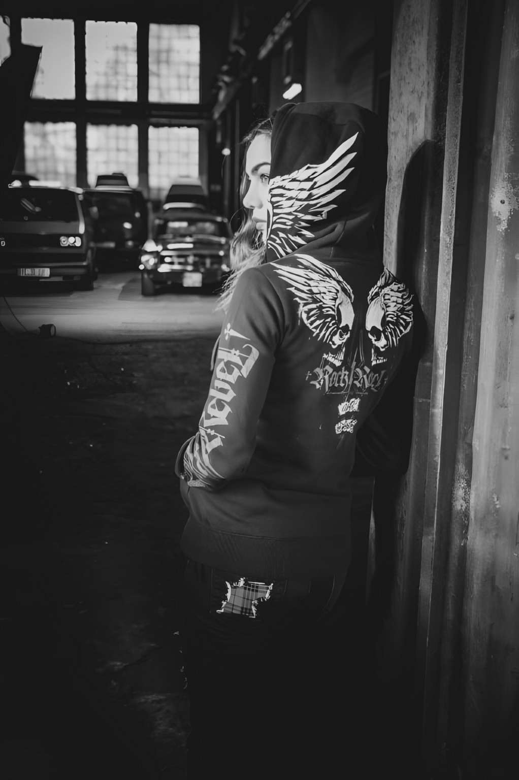 grayscale photography of woman wearing long-sleeved shirt