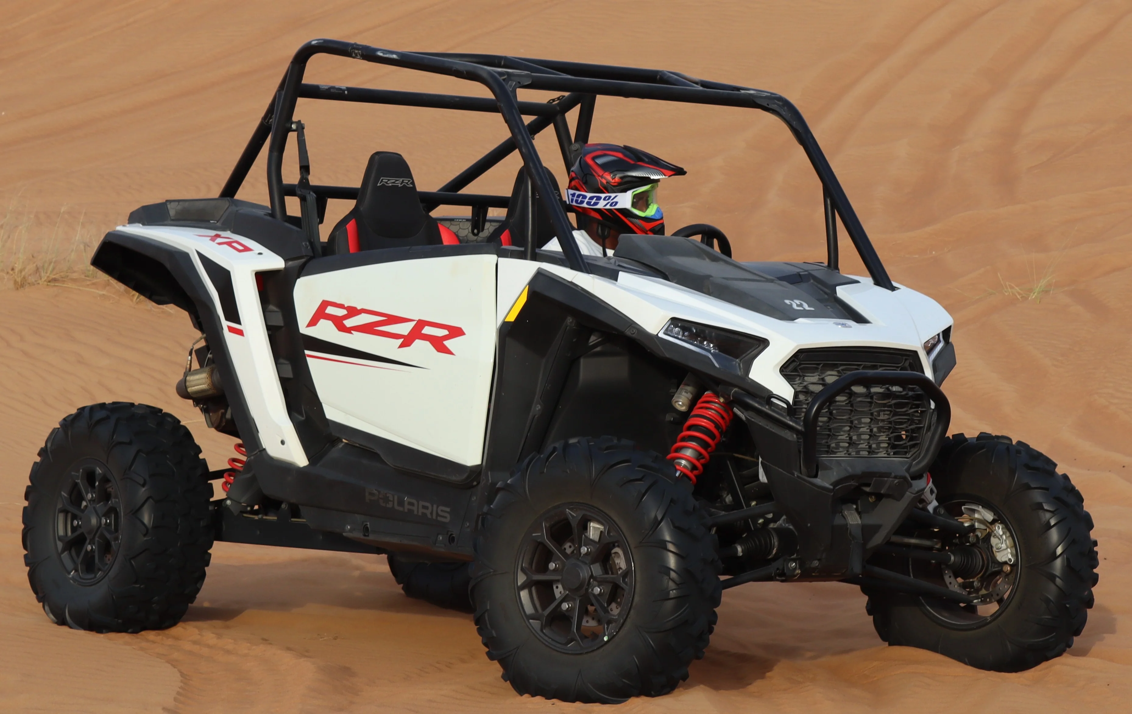 Polaris RZR 1000cc XP 2-seater dune buggy in the Dubai desert available with Dune Quest Tours