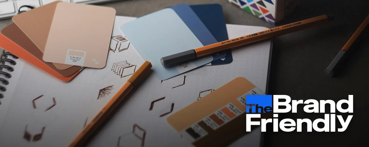 Title card graphic for Kindred. The Brand Friendly logo is layered over an image of a creative, branding style work desk full of papers, sketches, and color swatches.