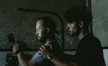 Reilin supporting a camera man