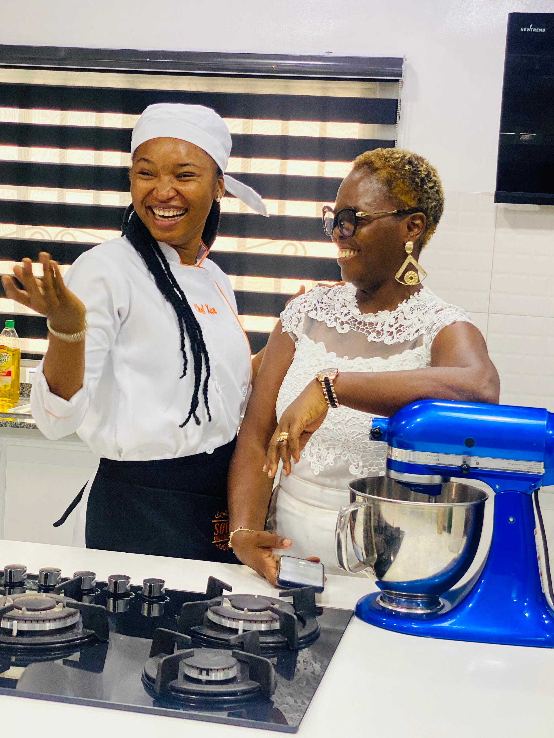 Chef Xan smiling with a woman