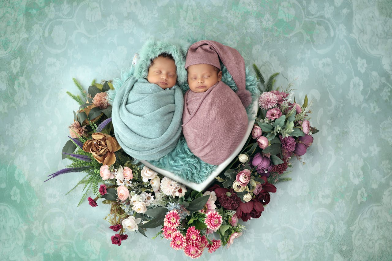 Twin photoshoot session using the snuggle wrap pose.