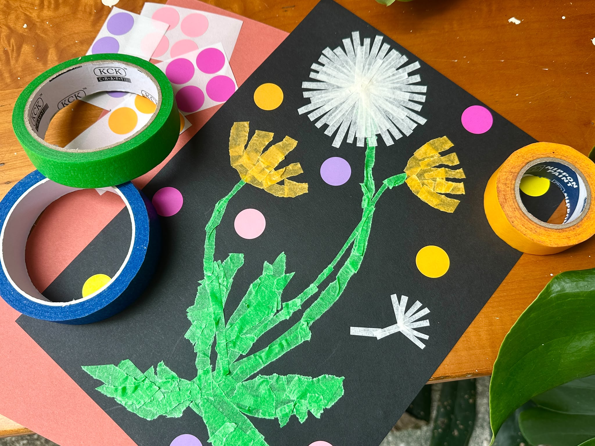 Watercolour floral cards and brushes on an art desk