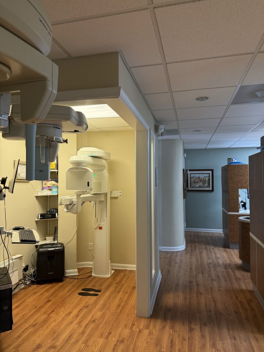 Advanced dental digital X-ray and panoramic imaging equipment in a dedicated radiology suite for precise patient diagnosis.
