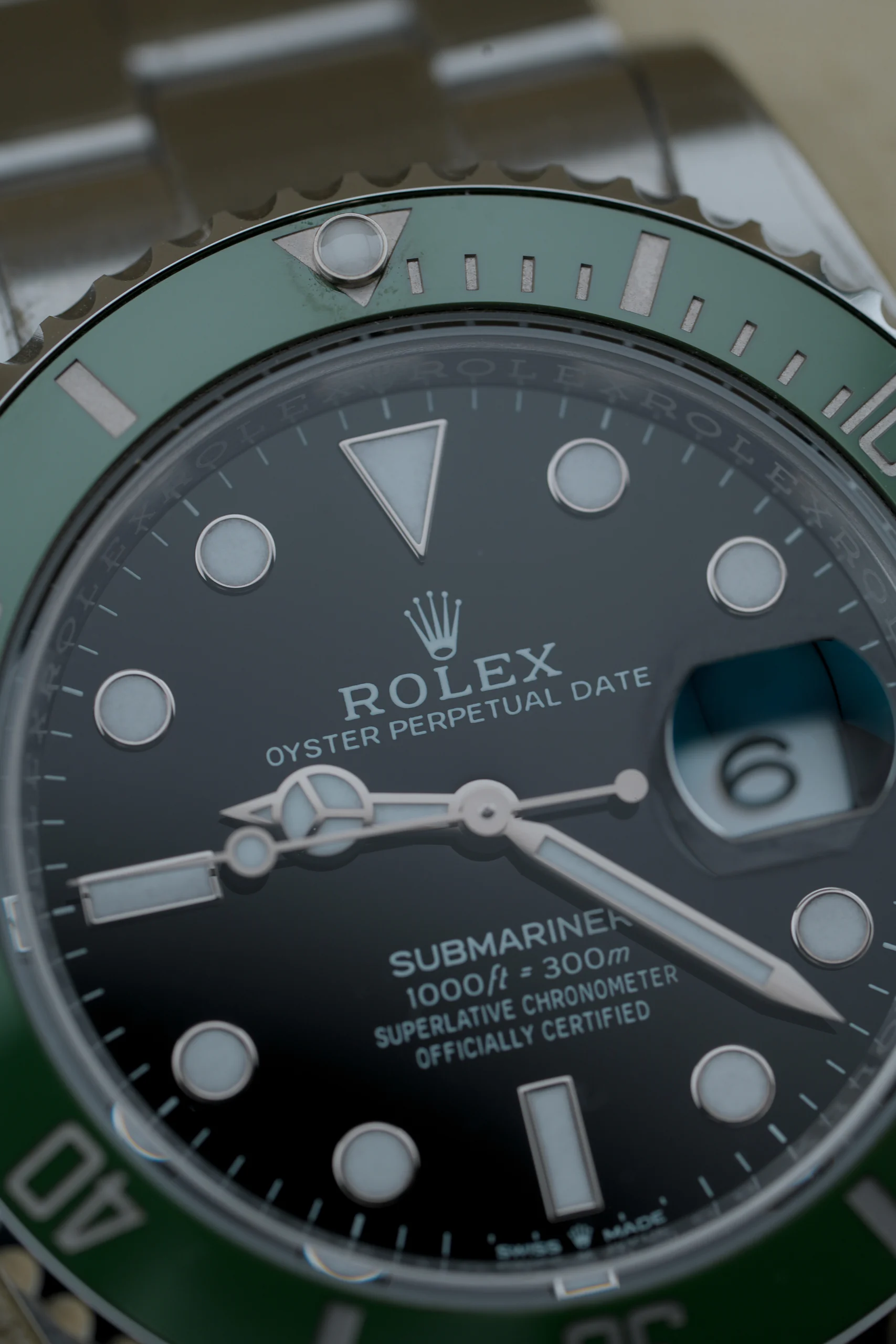 Close-up of the black dial on the Rolex Submariner Date Starbucks 126610LV