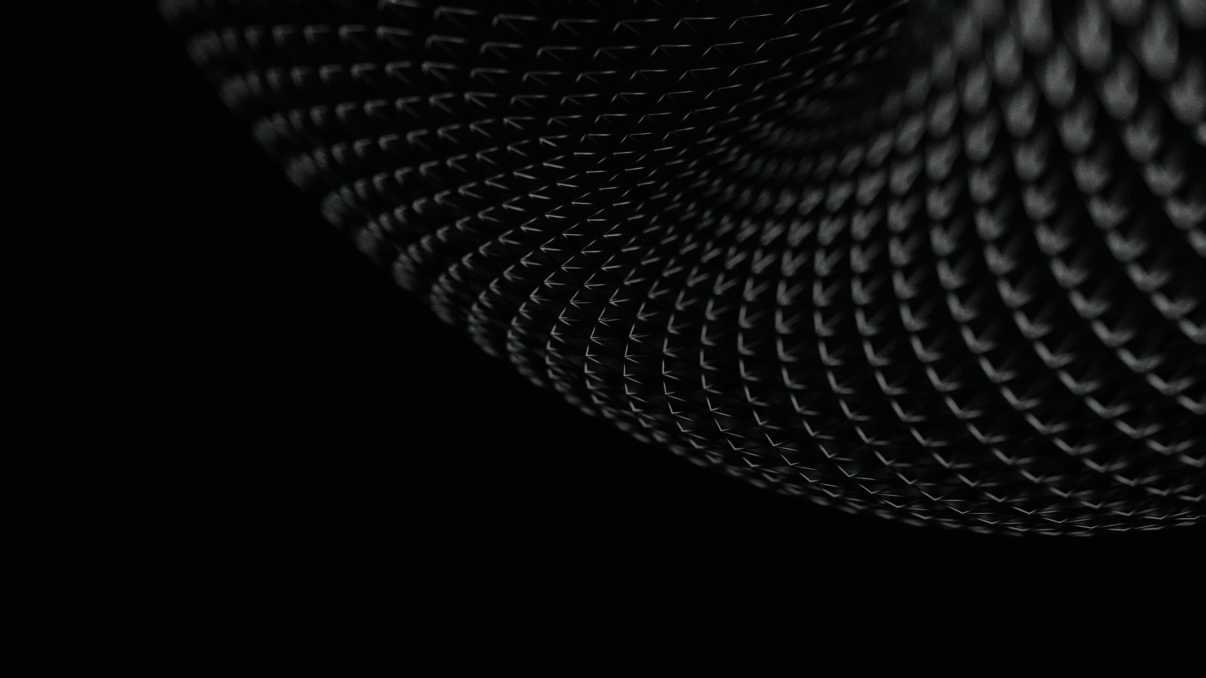 person sitting on grass and using phone