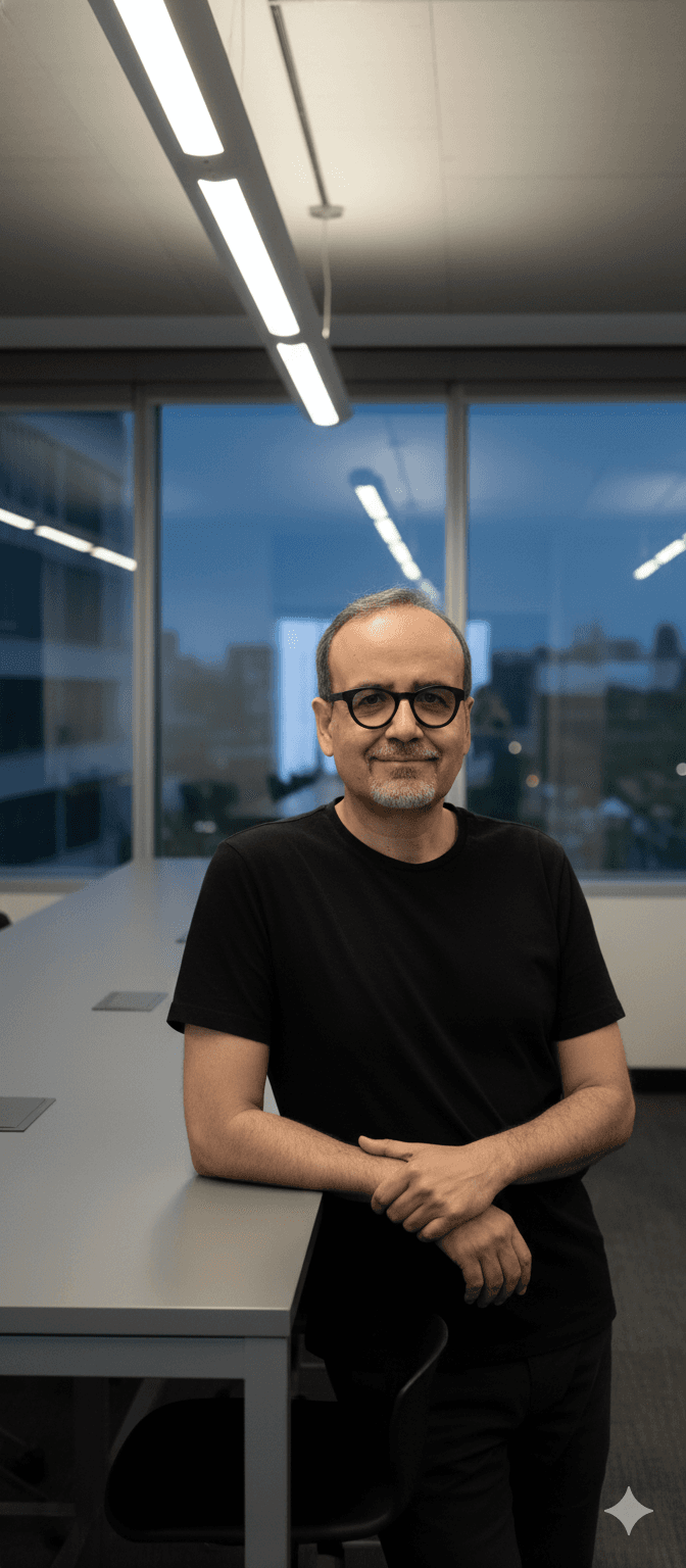 a man wearing glasses and a black shirt