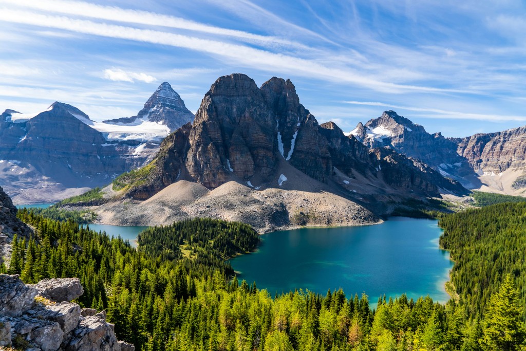 A mountain and a lake surrounded by trees