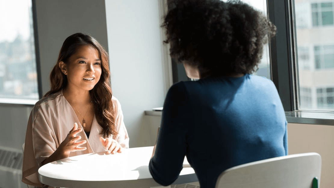 High school student working on a research paper with a PhD mentor during a weekly online session