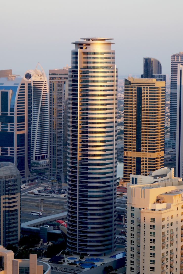 Aerial sunset view of Horizon Tower, highlighting premium real estate investment opportunities in Dubai.
