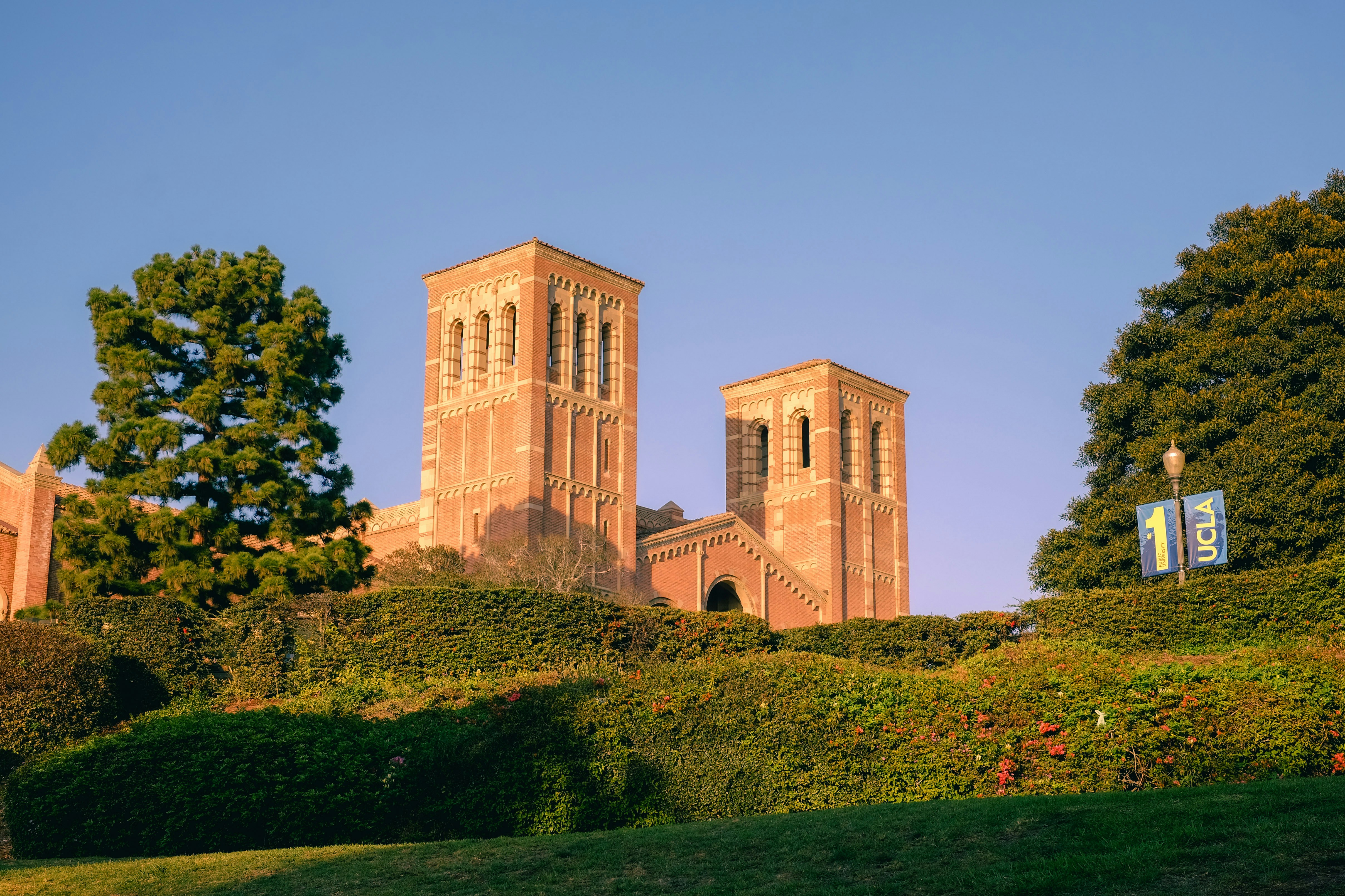 A building with two towers on top of a hill