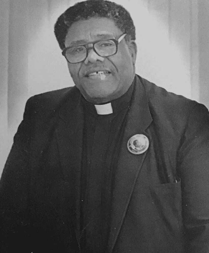 A group of people praticing yoga on the beach in the morning