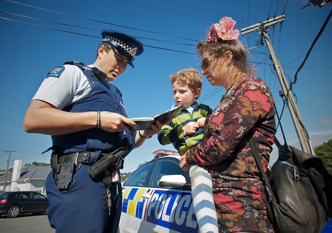 A group of people sitting on the steps of a building