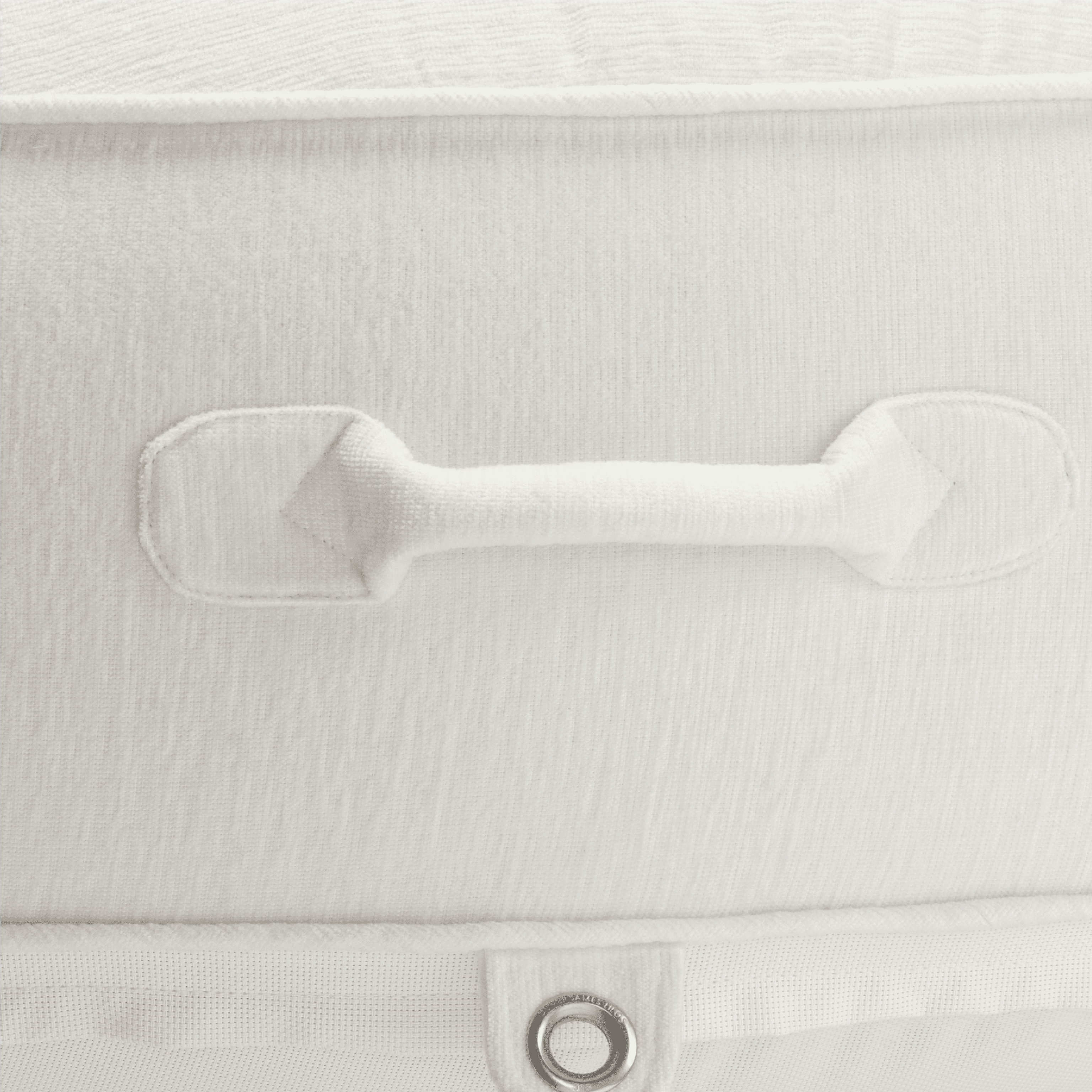 White chenille pool float detail showing padded carry handle, soft texture, and silver stainless eyelet