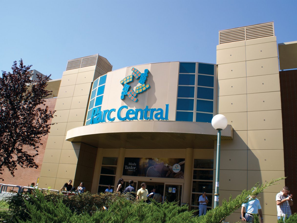Rooftops of a coastal town with the sea in background
