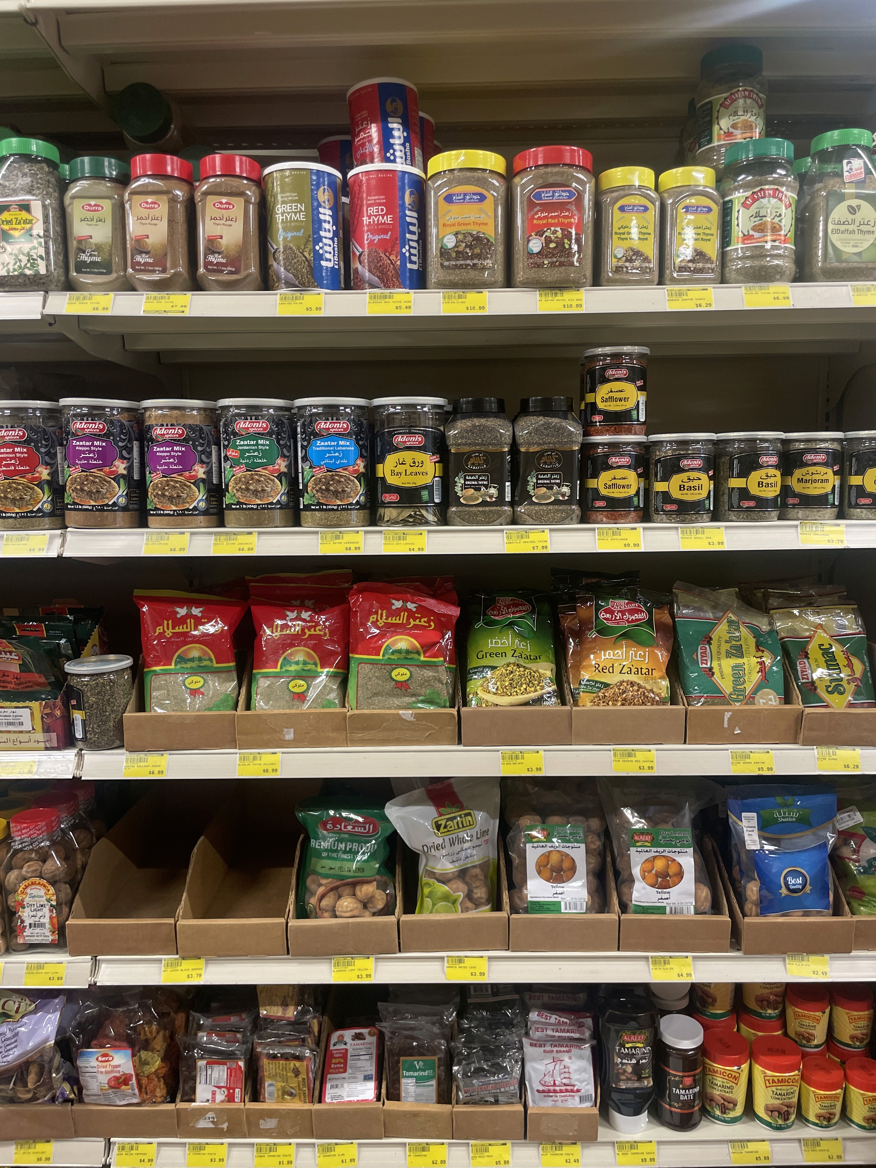 Variety of spices and seasonings at International Food Market Orlando, featuring popular brands.