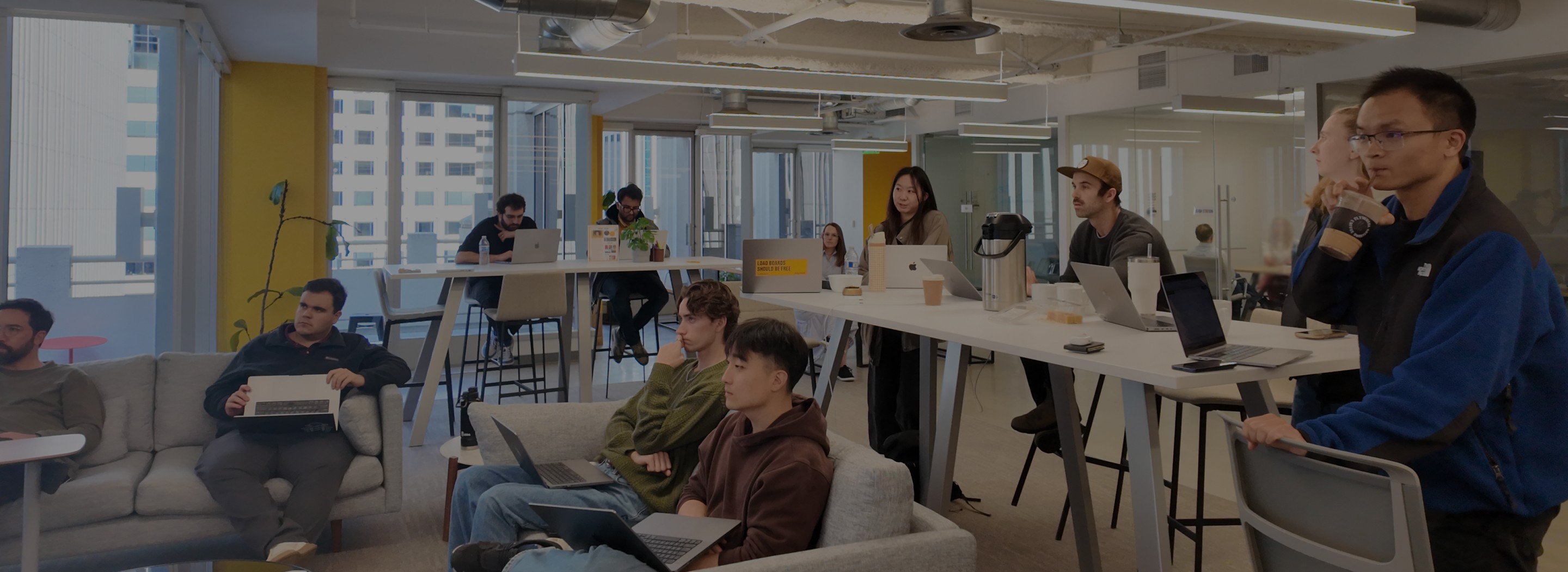Overhead view of an open road between trees and landscape