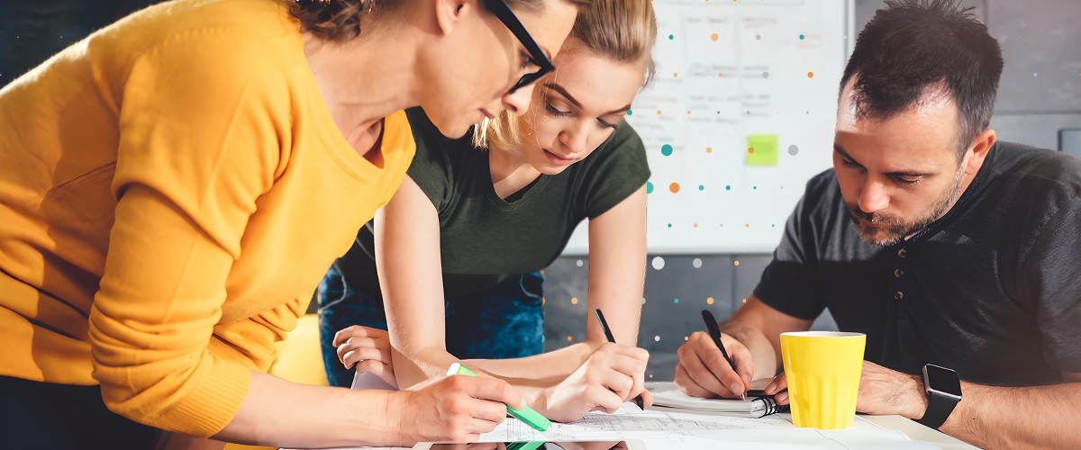 people writing notes on paper