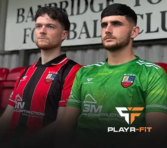 2 banbridge town players displaying the new Banbridge Town kit