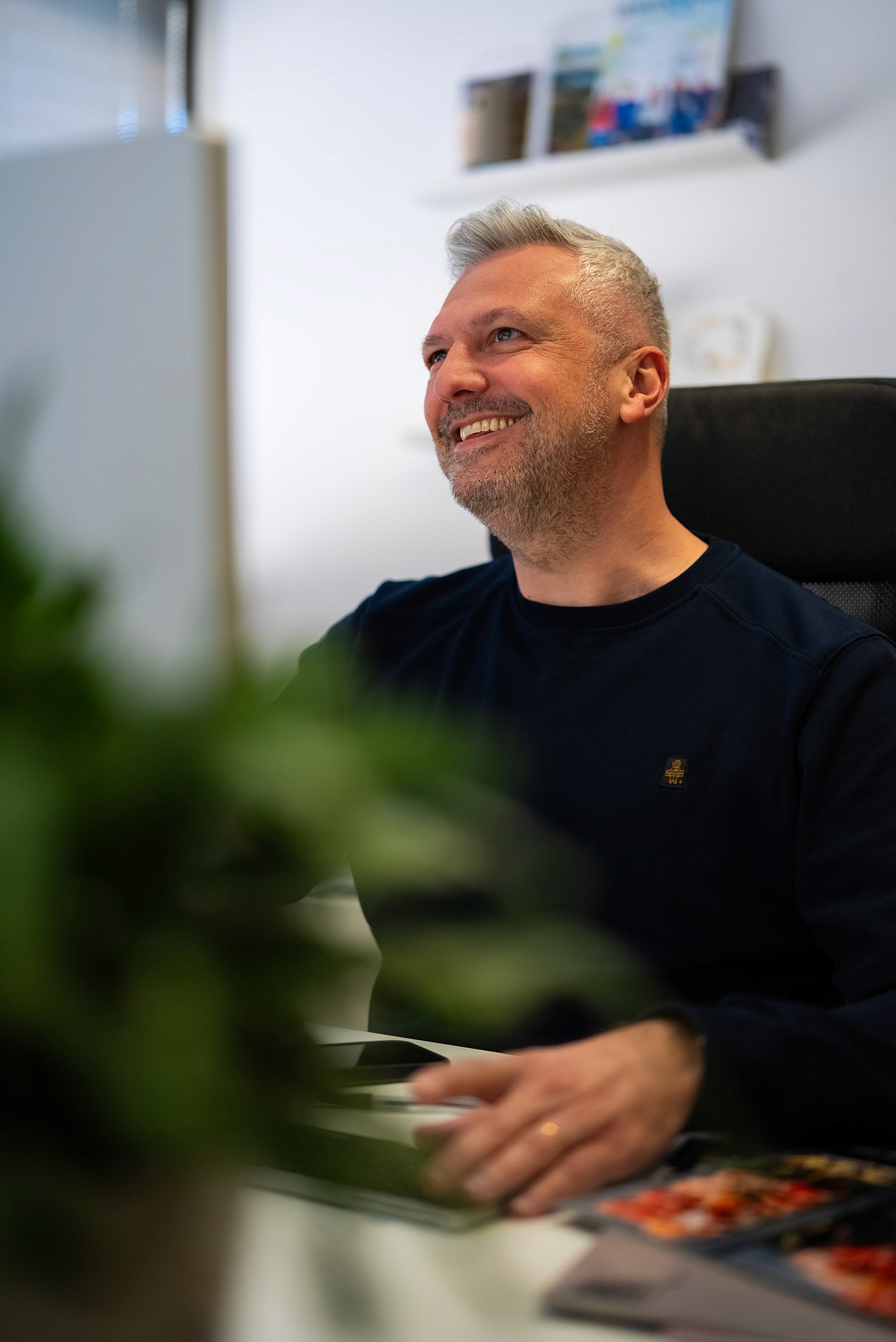A woman smiling sitting in the office