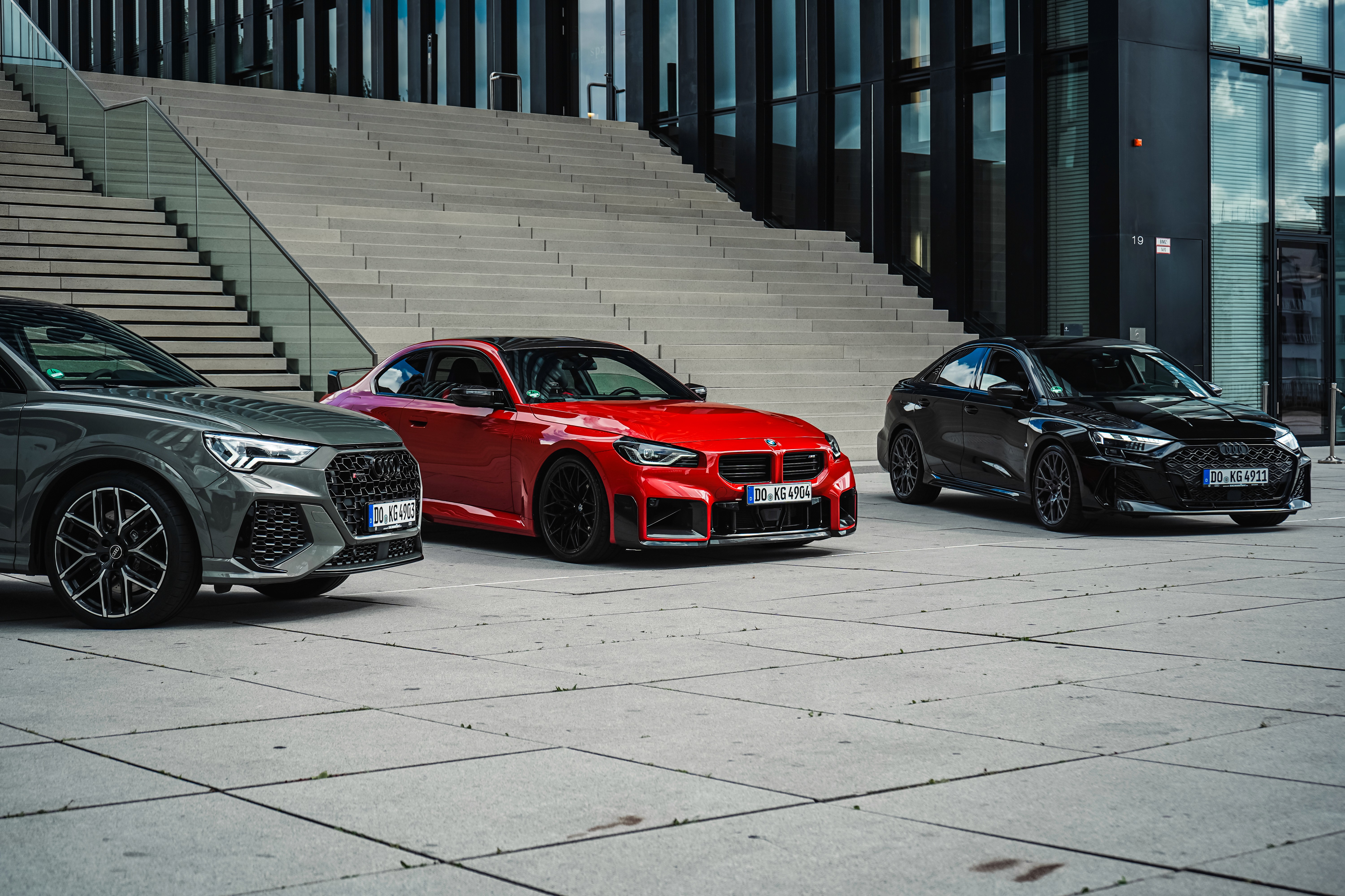 Two happy men driving a sportscar with a joyful expression, ideal for car rental adventure promotions.