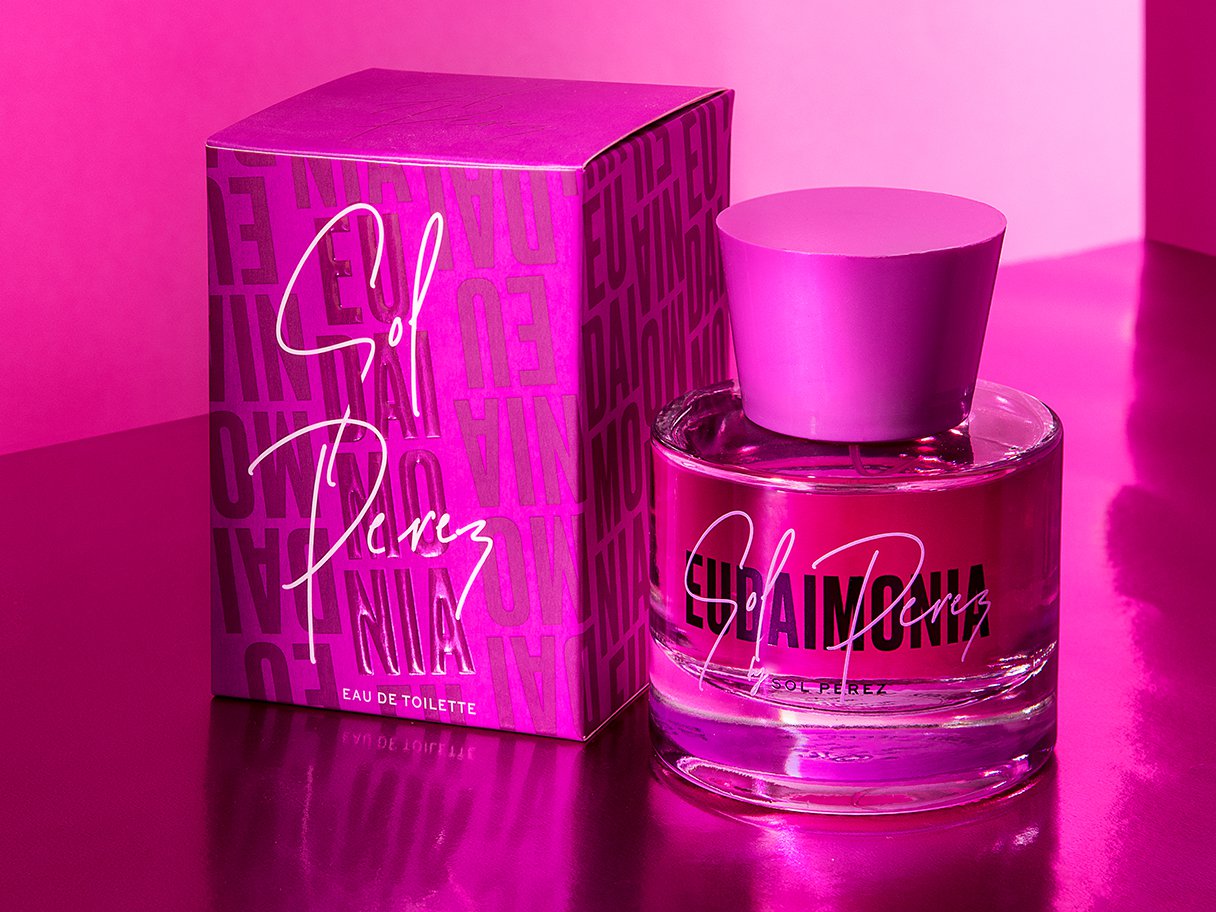 Rustic cabin in a golden field at sunset