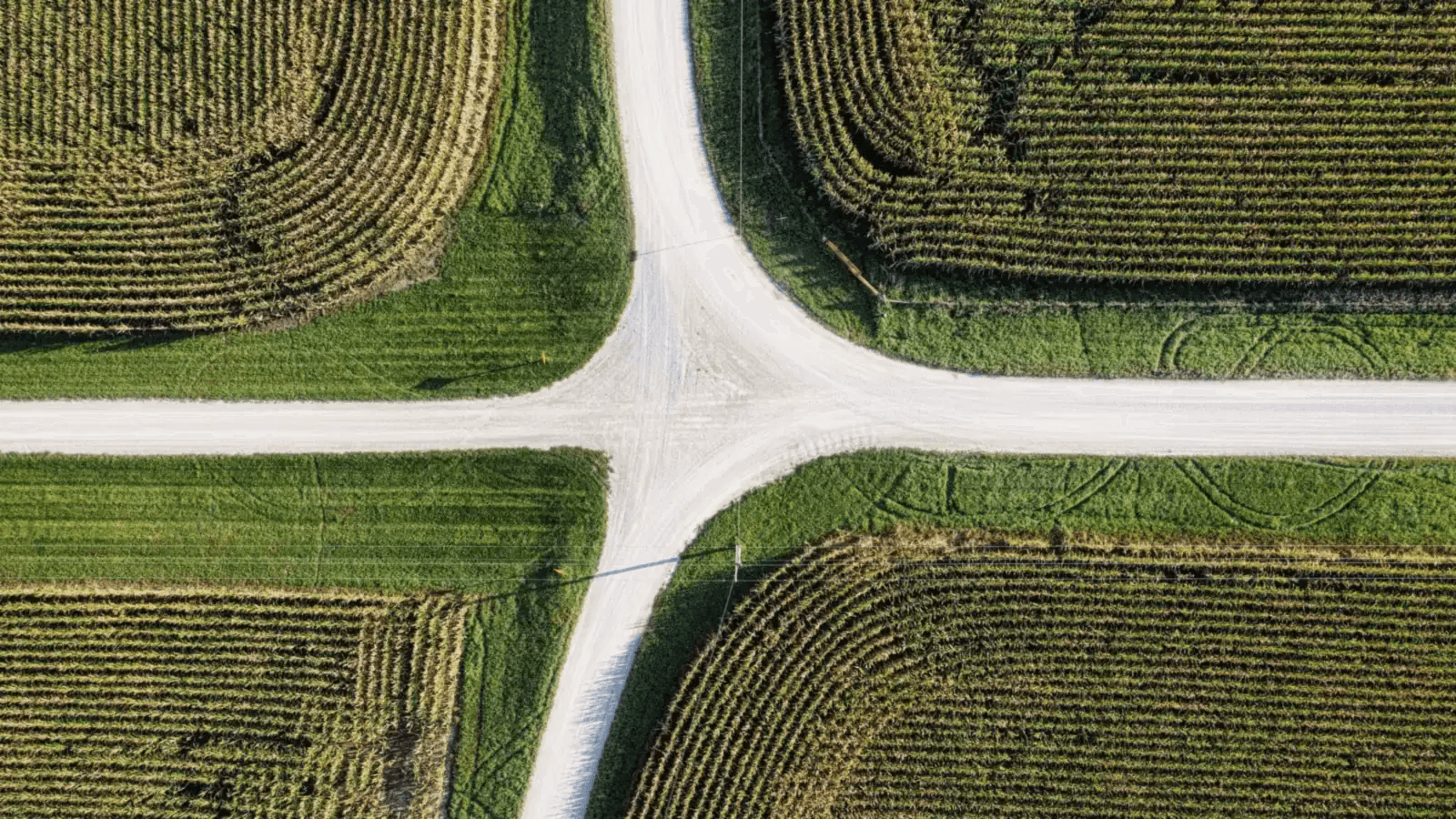 Aerial view of a crossroad between open fields