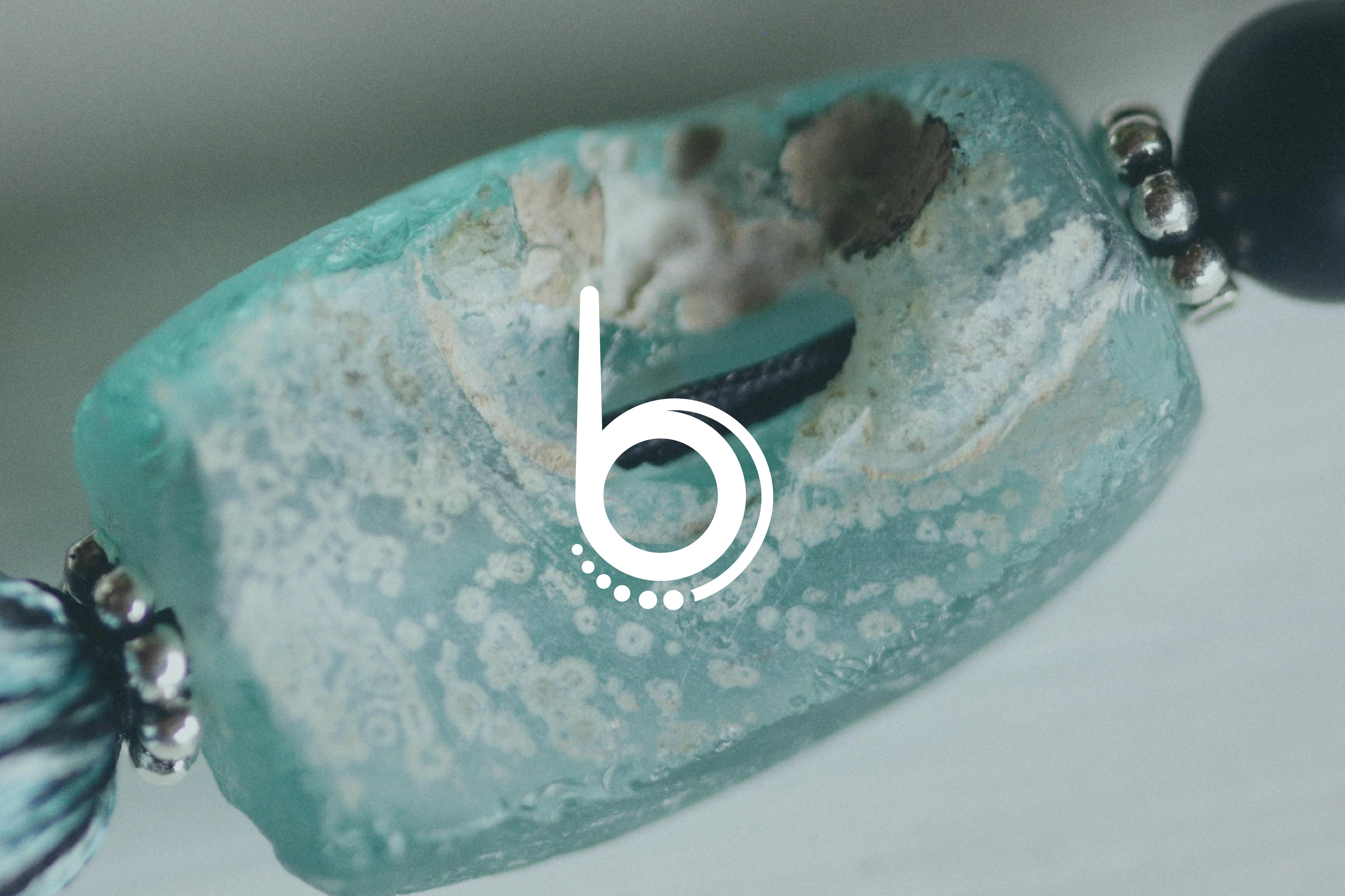 Streetside billboard with flyposters of the Batch.Works brand and illustrations