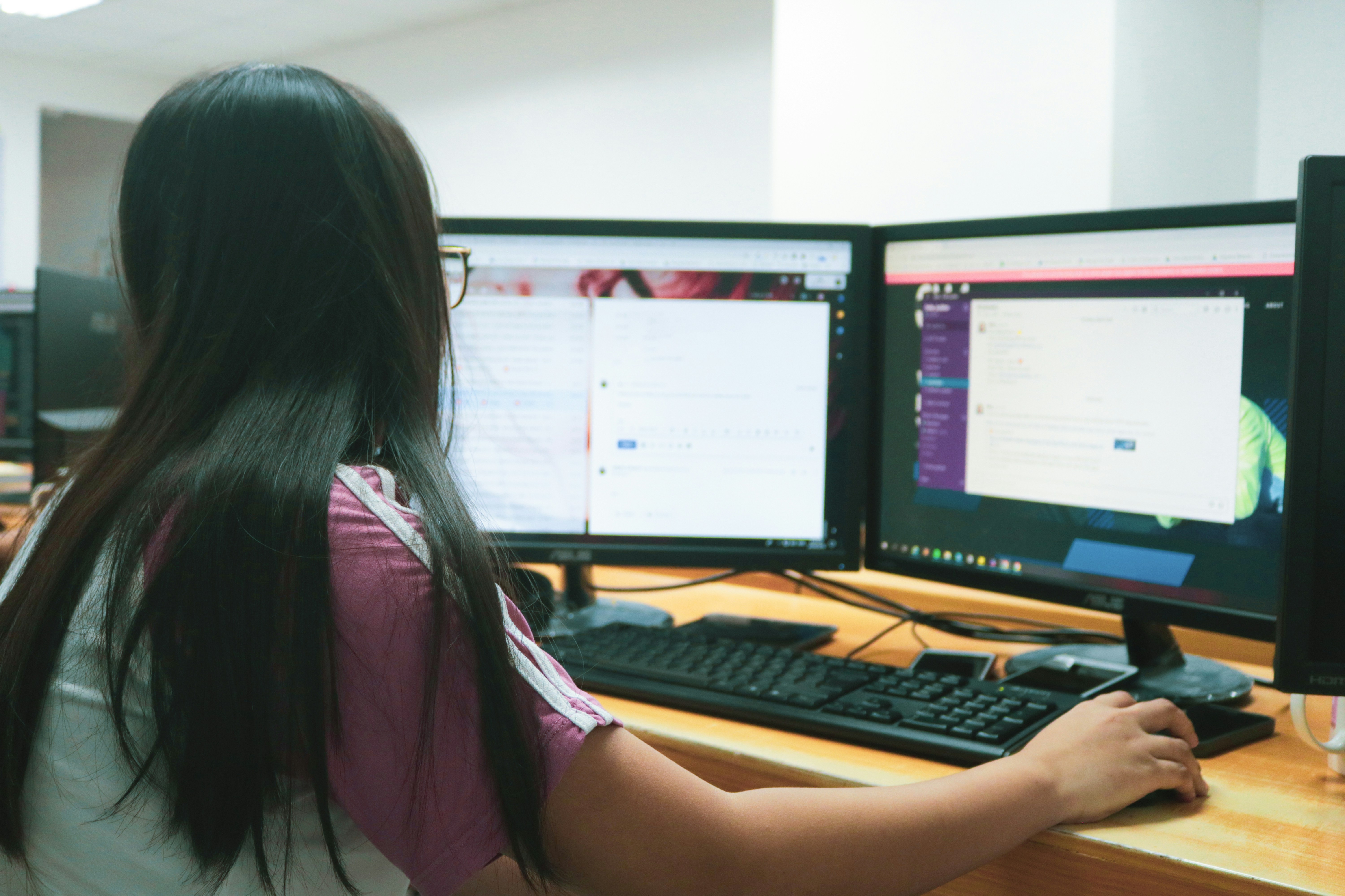 woman looking at her mailbox in office - Best Email Folder System