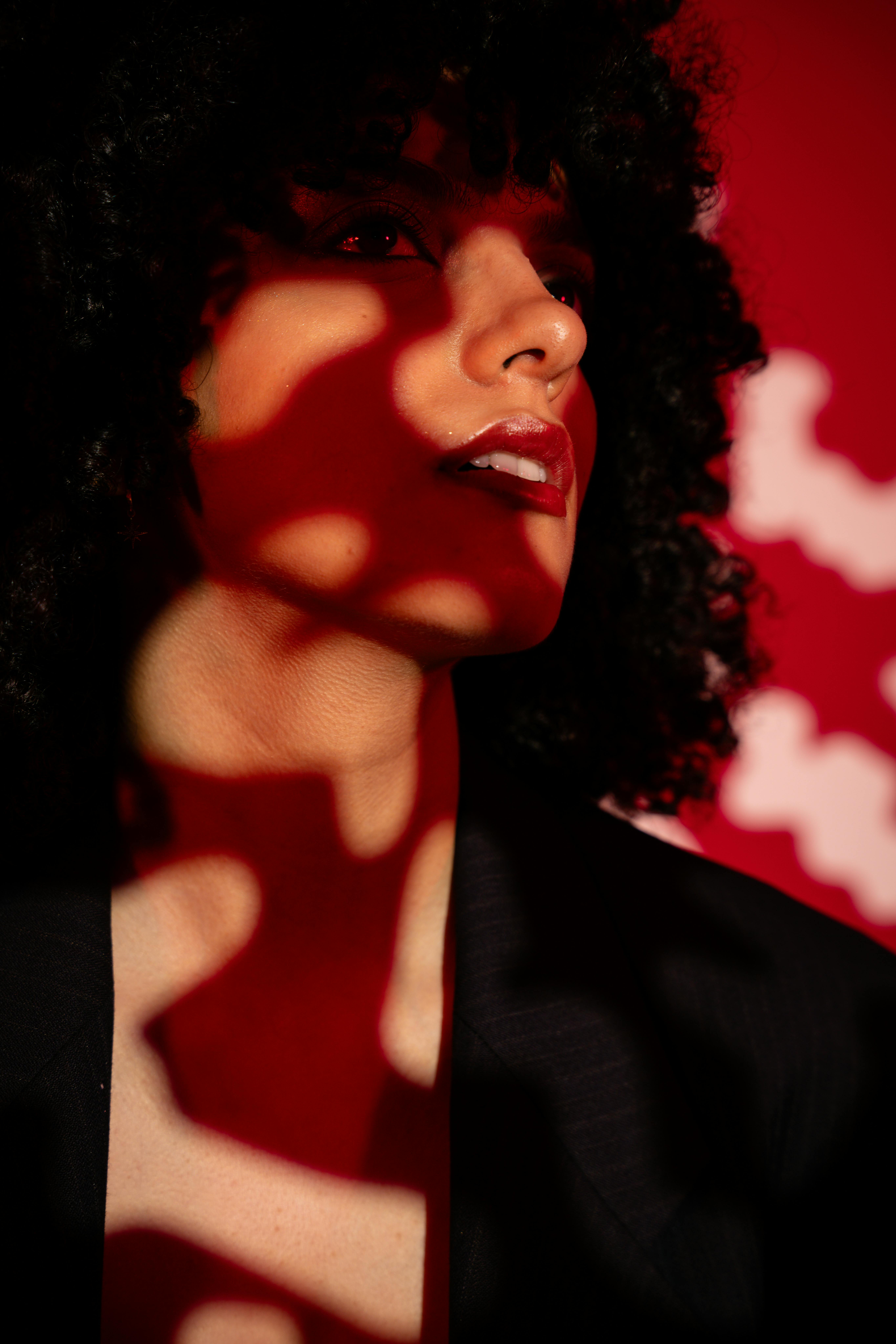 Woman portrait on red background