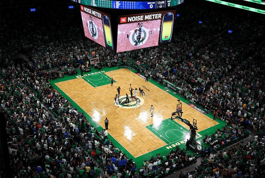 a group of people walking on a sidewalk