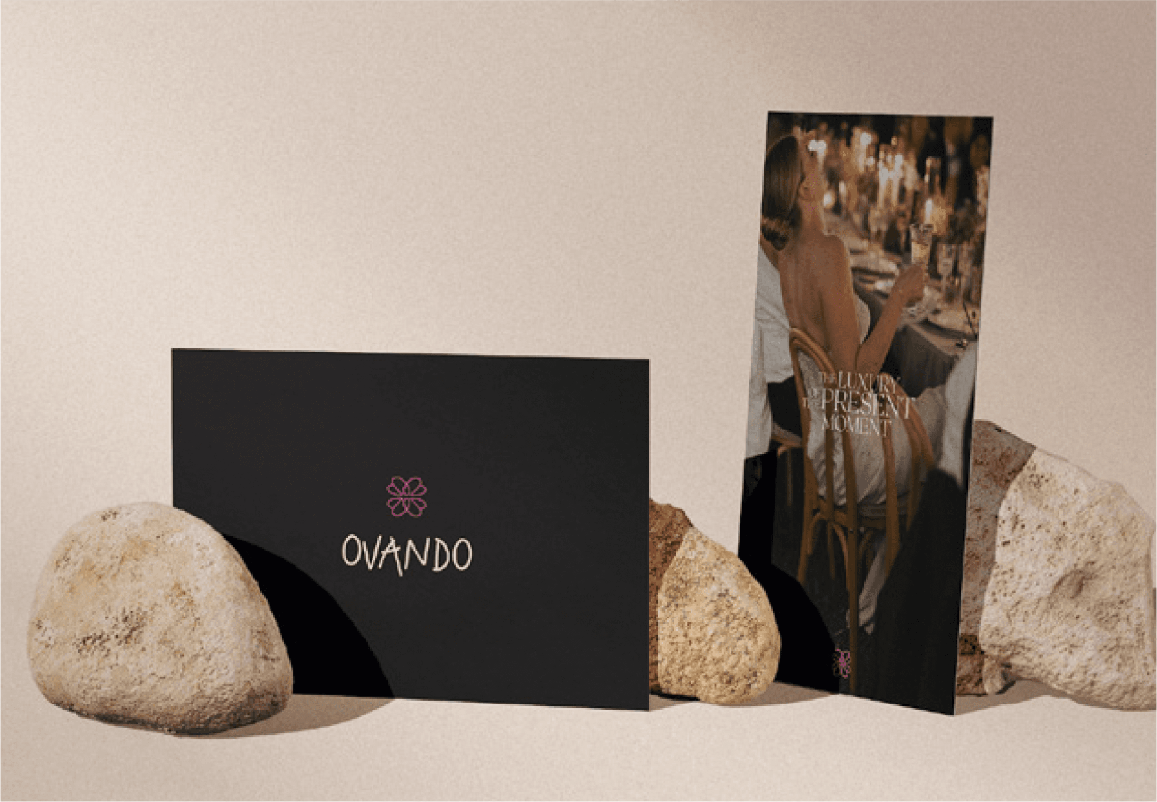 man standing on rocks wearing a winter jacket and a pair of trackpants