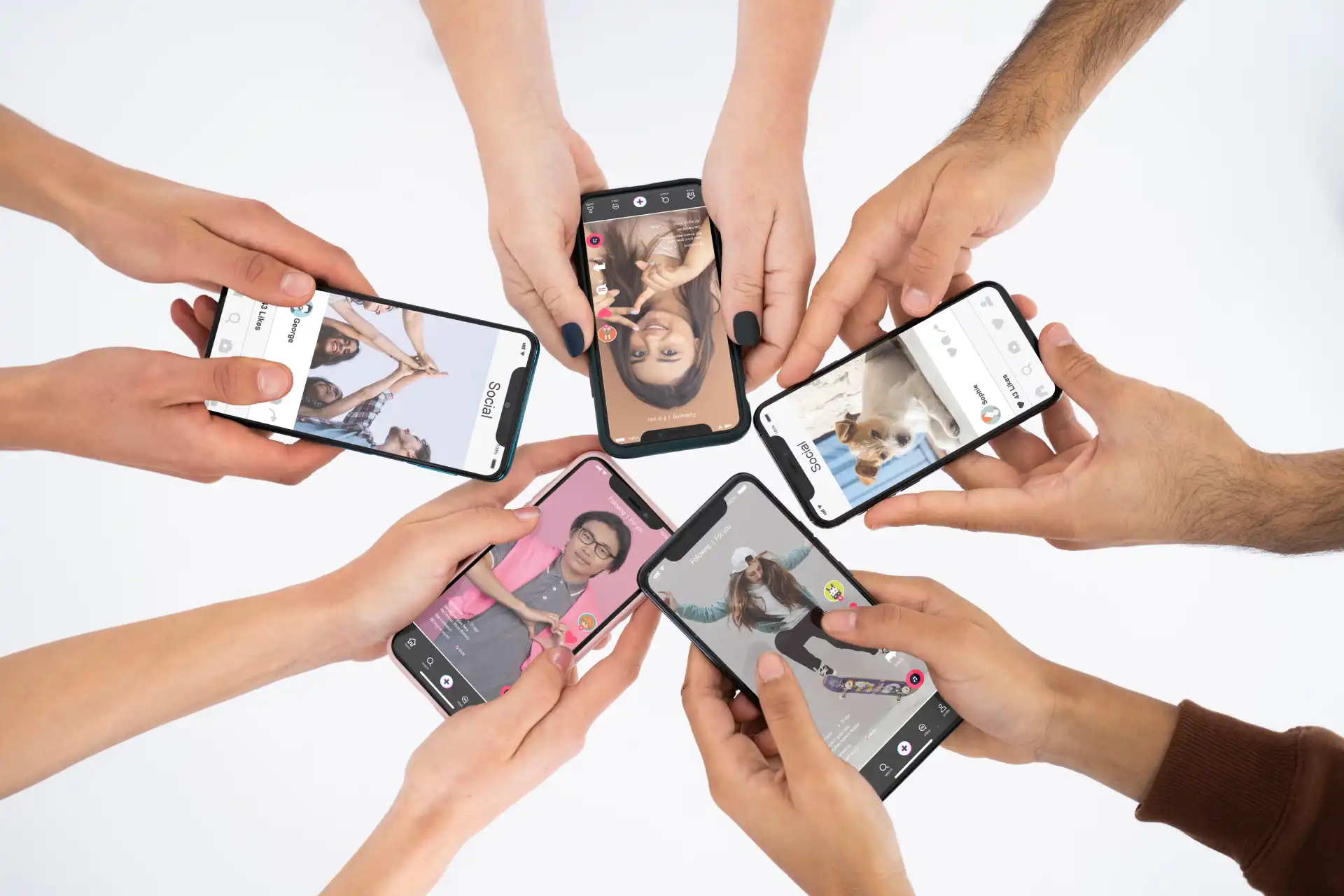 Multiple hands holding phones showing TikTok content, illustrating viral reach through traffic pools and algorithm distribution