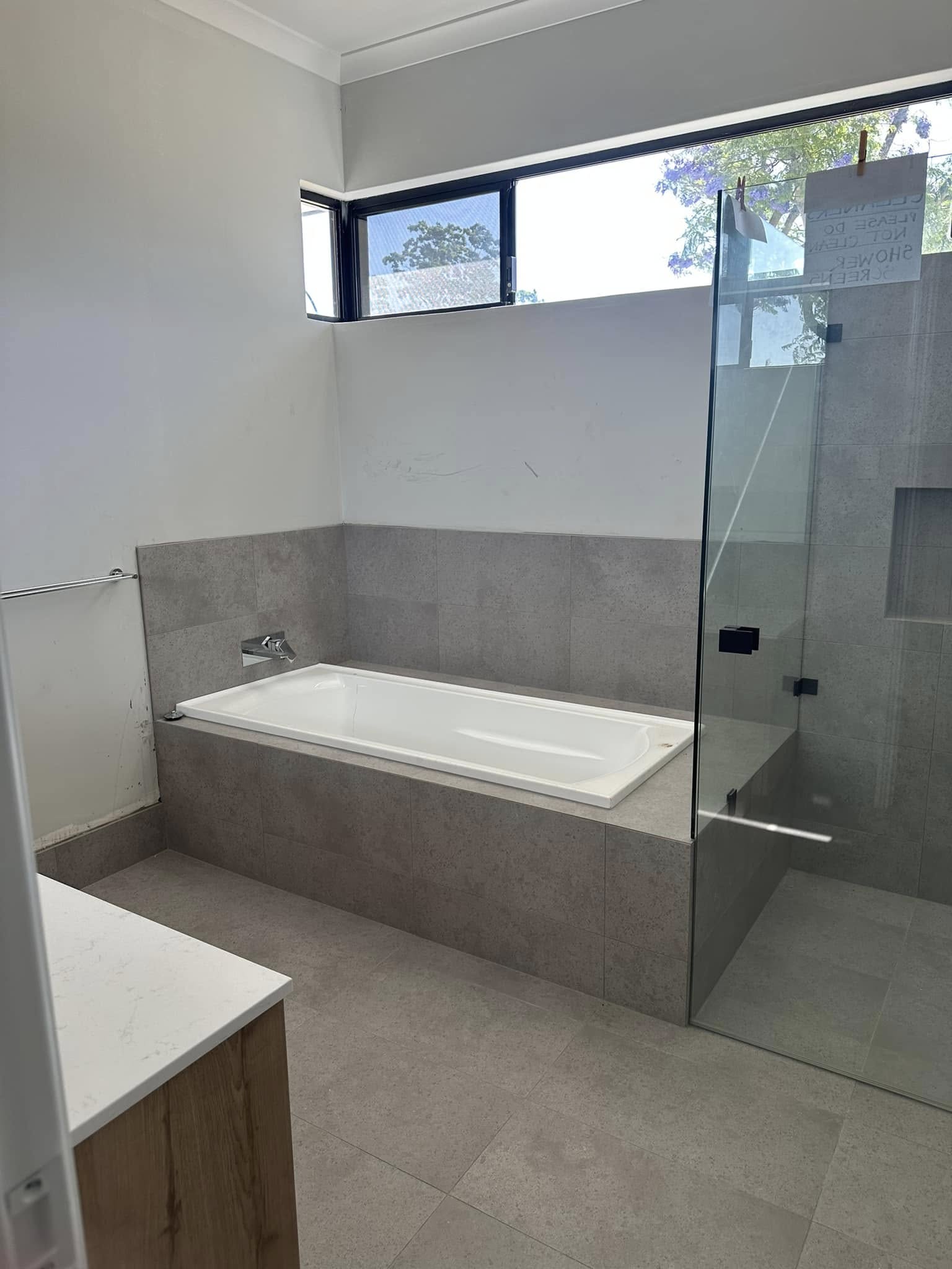 Electrician drilling in a wall