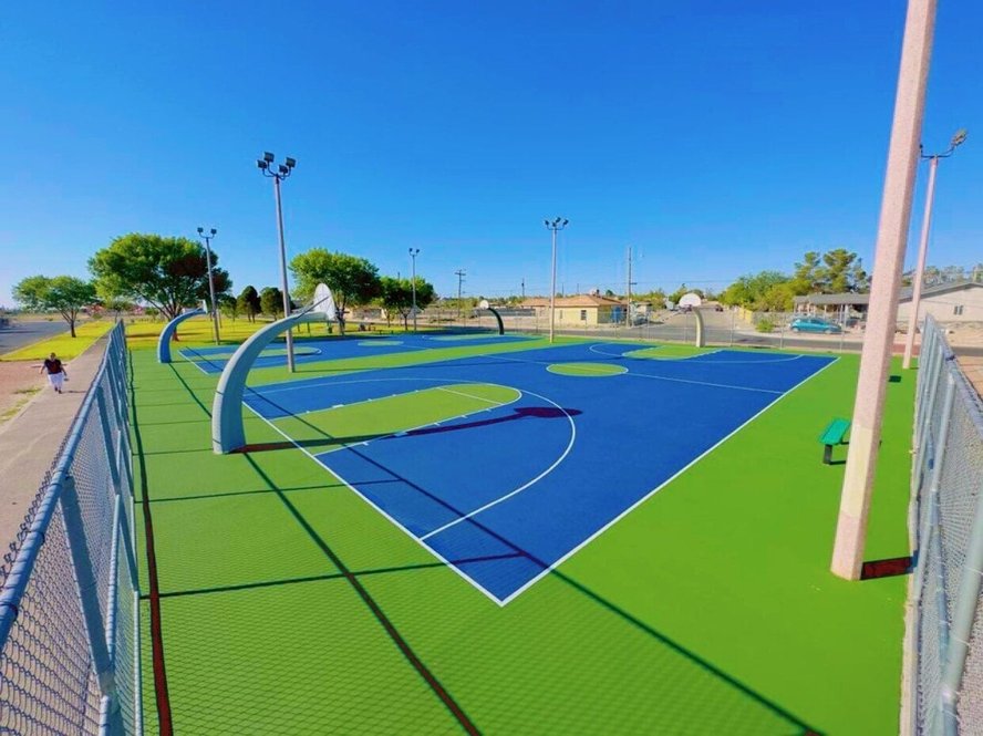 Fully renovated multipurpose court in El Paso, TX featuring a smooth, crack-free surface, vibrant new paint