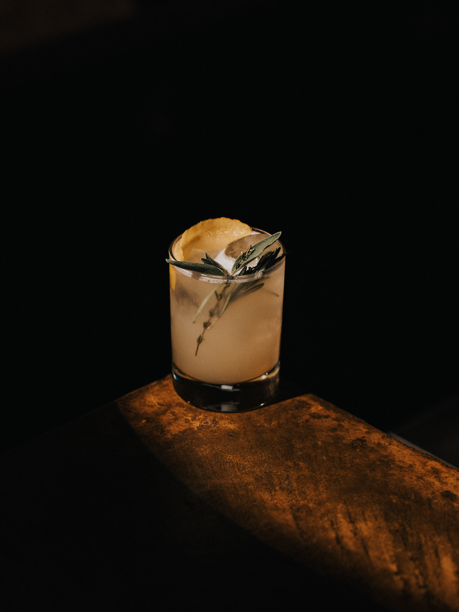 Bottles of olive standing on the marble counter