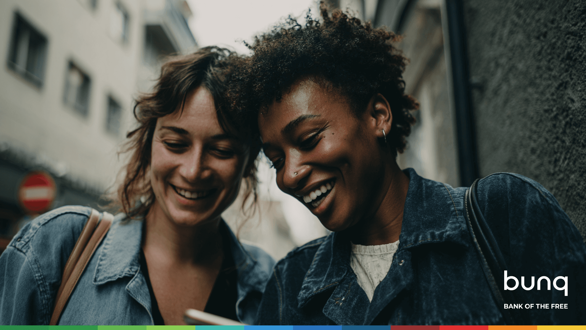 A maroon passport, a credit card, and a document are placed on a dark surface.