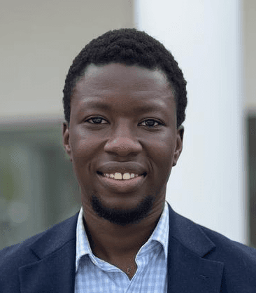 smiling woman wearing white and black pinstriped collared top