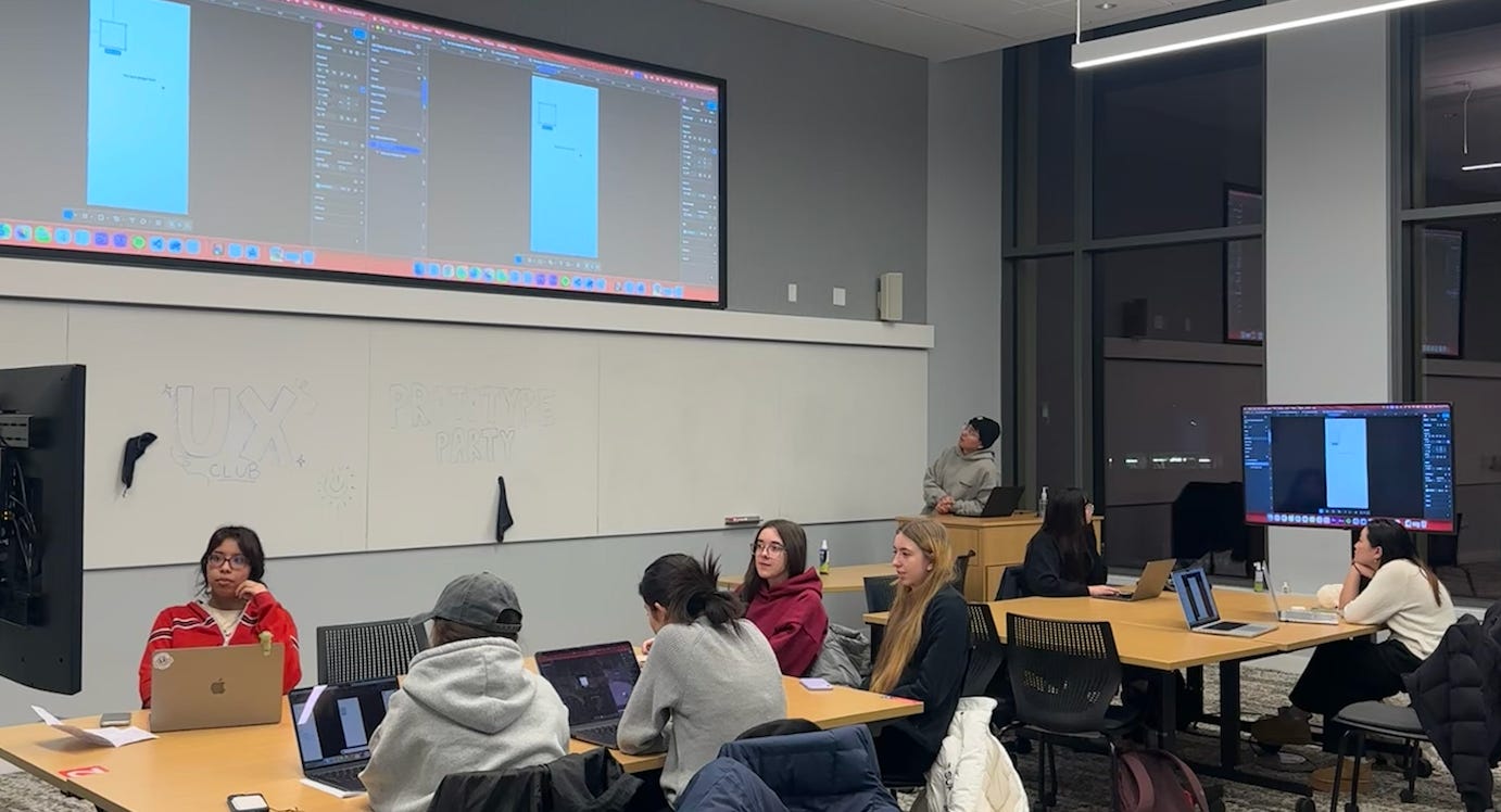 Prototype Party Workshop attendees sitting at tables in groups