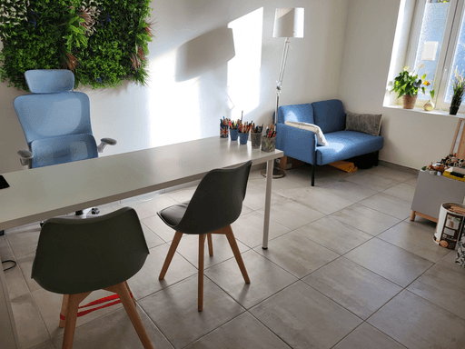a room with a table and chairs