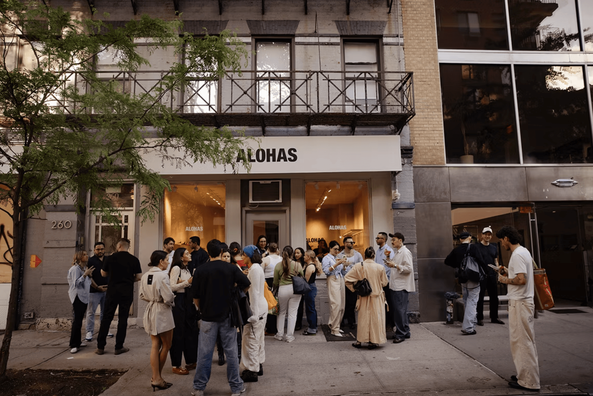 Opening night at the Alohas New York retail store, with a crowd gathered outside beneath the brand’s storefront signage.
