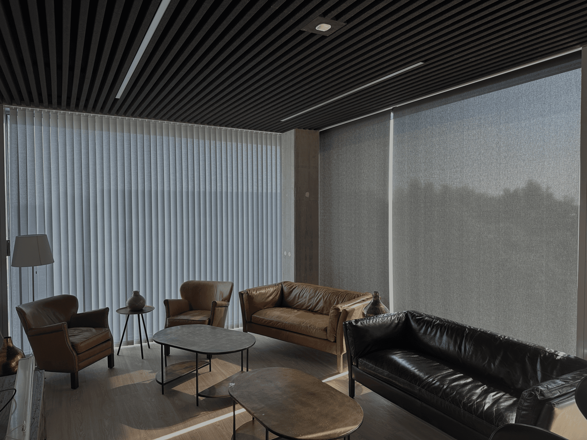 Curved white staircase with dramatic natural light in a modernist interior