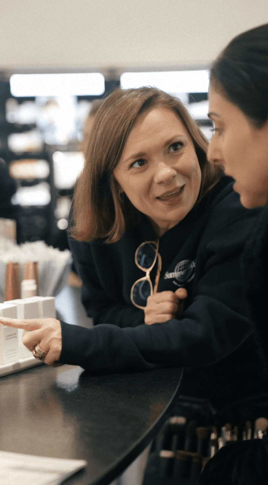 Bride and groom walking on street at night