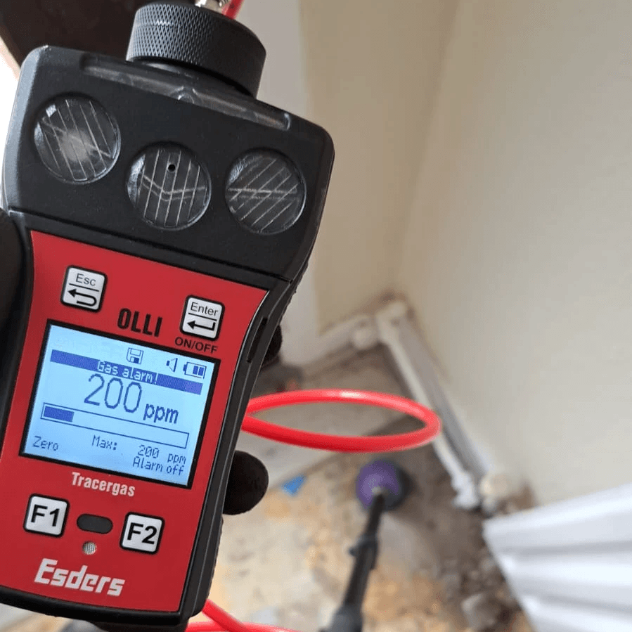 person holding yellow plastic bottle