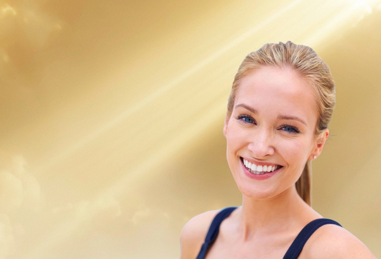 Smiling woman showcasing dental treatment results
